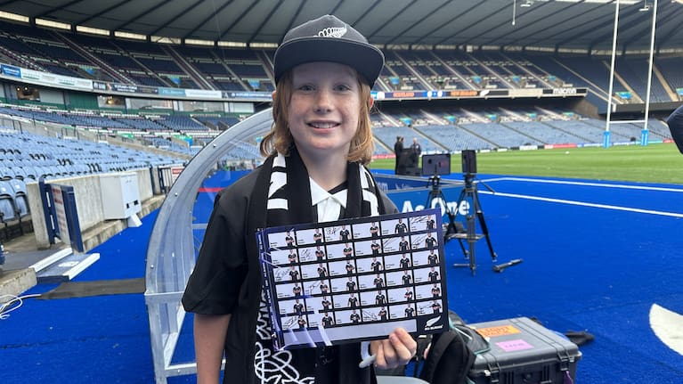 Photo shows Dutch All Blacks fan Felix Suichies proudly displaying signatures of players he met.