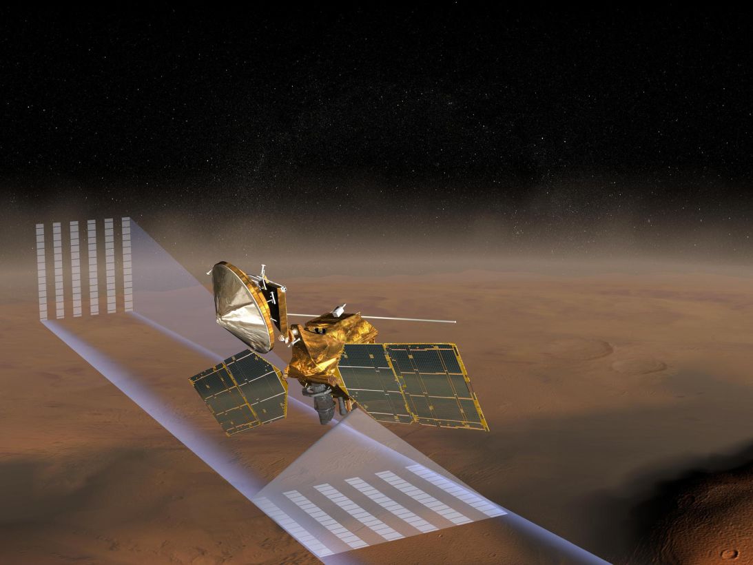This artist concept of NASA's Mars Reconnaissance Orbiter features one of its instruments — the Mars Climate Sounder — in action.