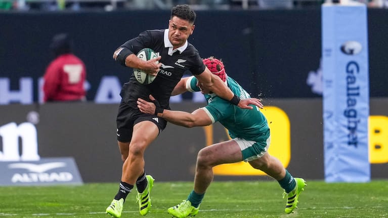 Quinn Tupaea gets around an Irish defender at Soldier Field.