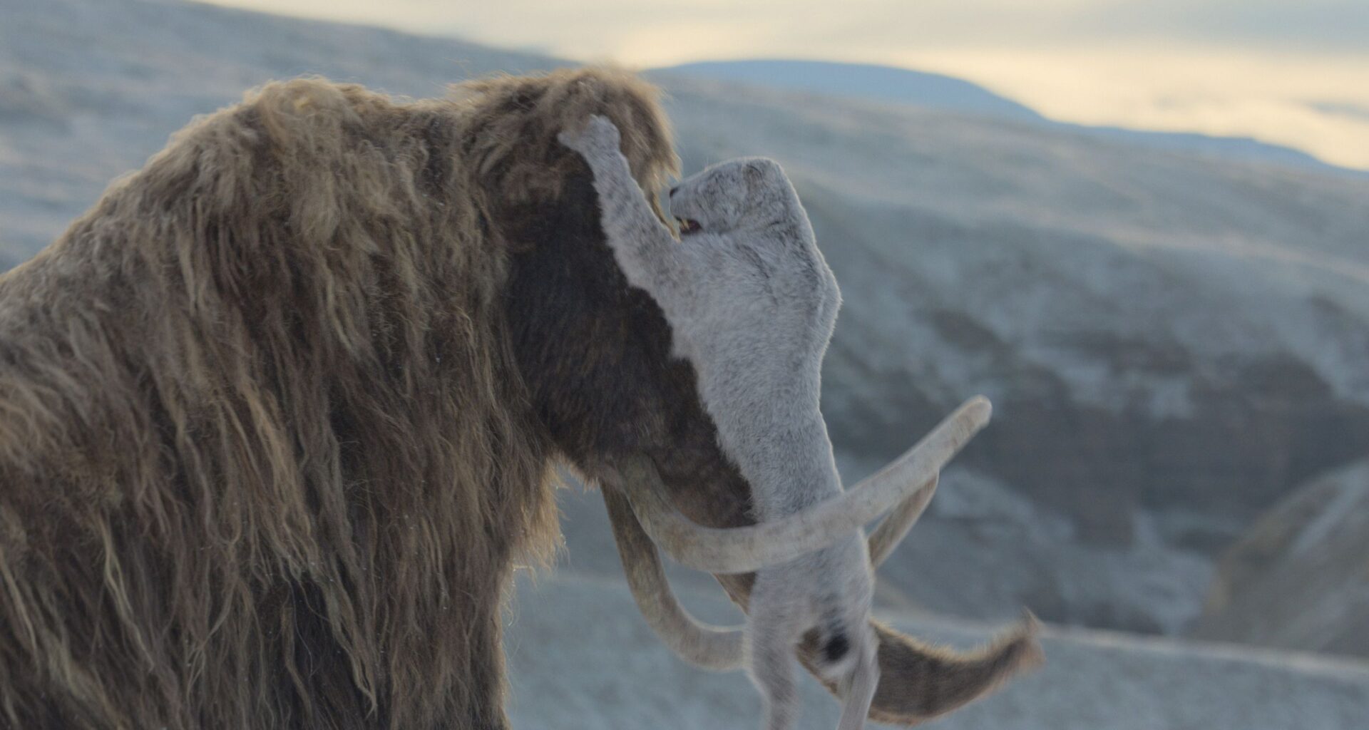 Woolly mammoths fight off attacking saber-toothed cats in stunning new 'Prehistoric Planet' clip