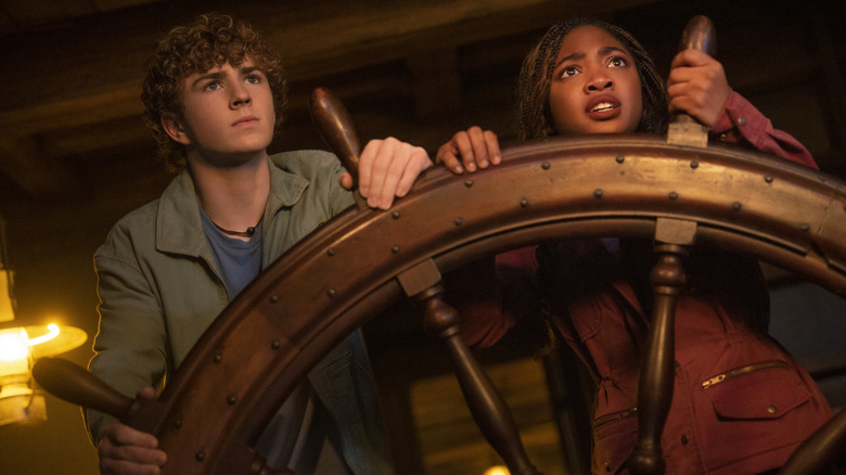 Percy and Annabeth holding a ship wheel in 