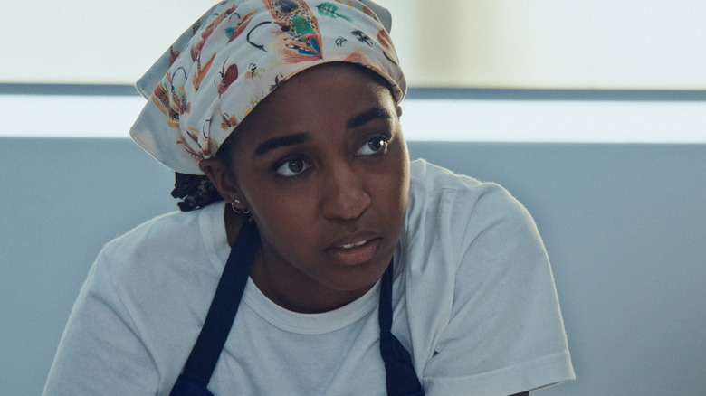 Syd looking intense in the kitchen in The Bear