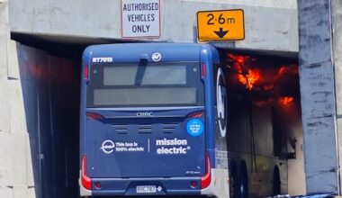 Bus on fire after colliding with overpass in Auckland's North Shore