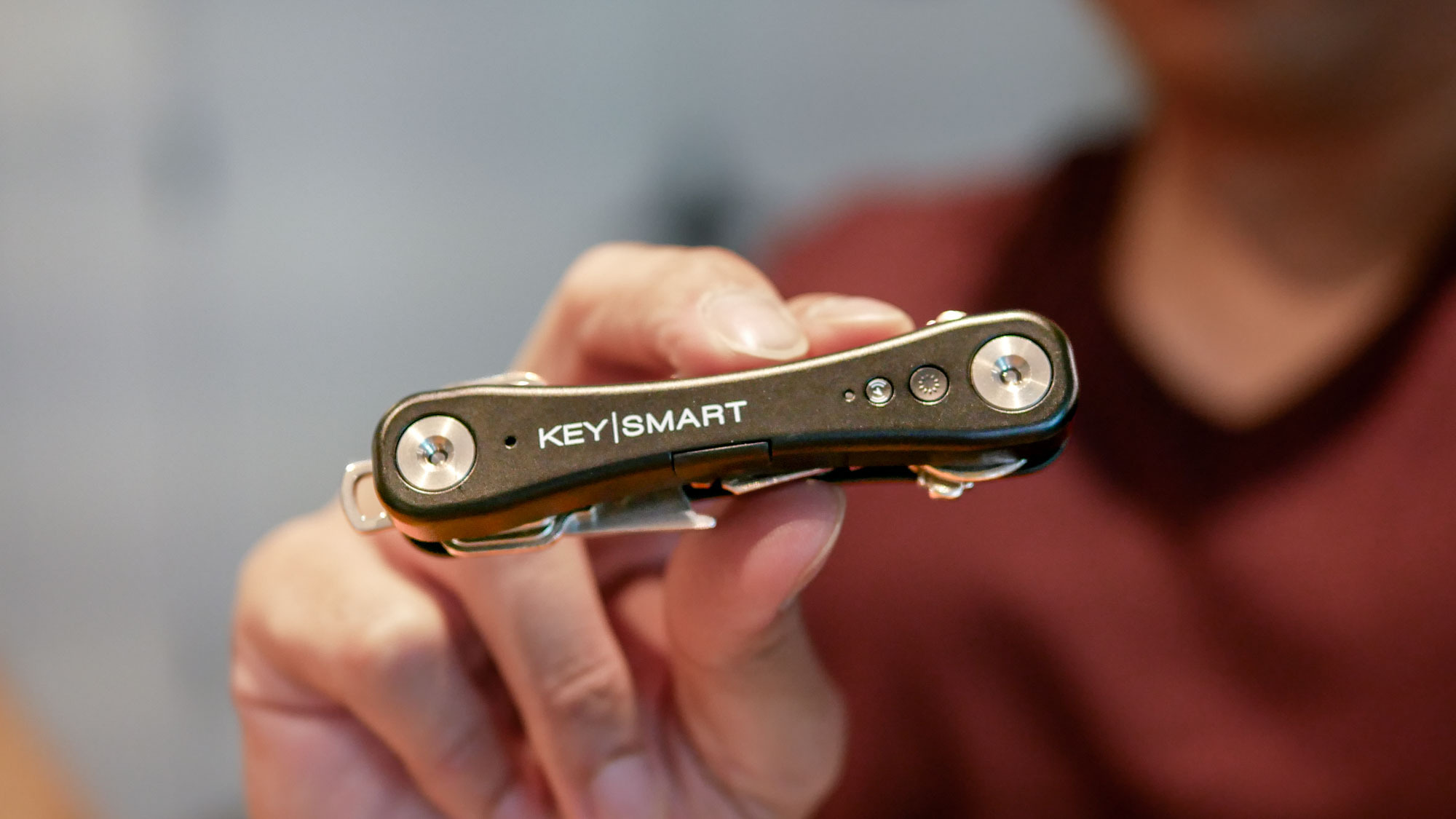 KeySmart iPro smart key tracker held in hand.