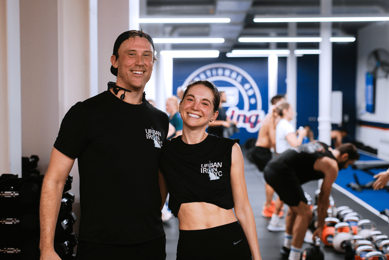 A pair of Urban Iron competitors smiling.