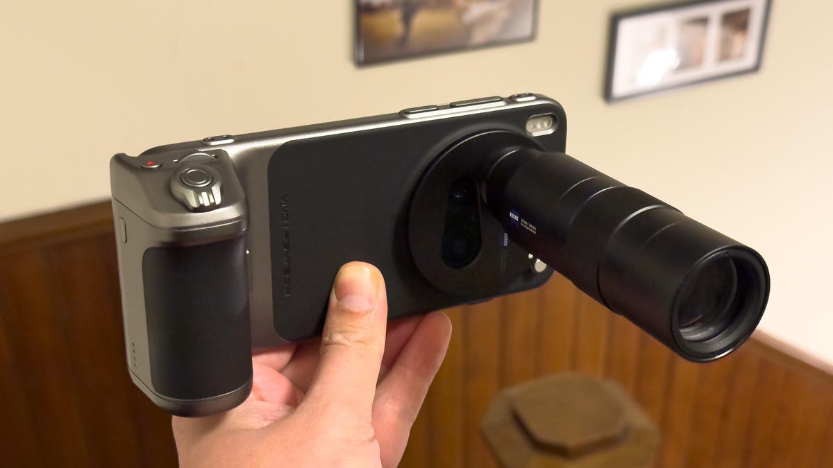 Image of a phone with a lens attached