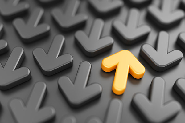 One yellow up arrow amid grey down arrows