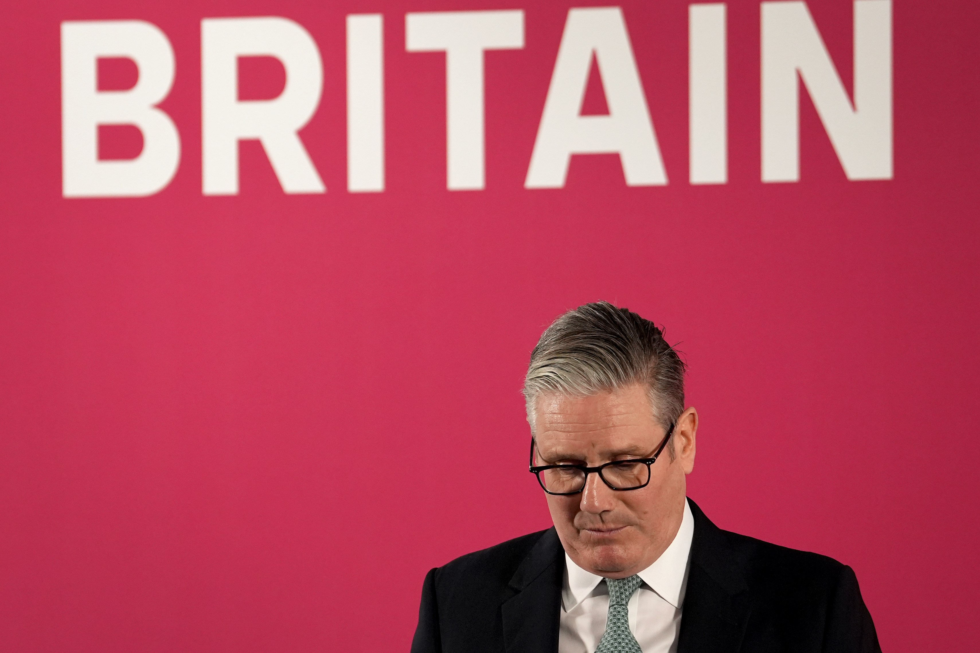 Keir Starmer at a podium delivering a speech.