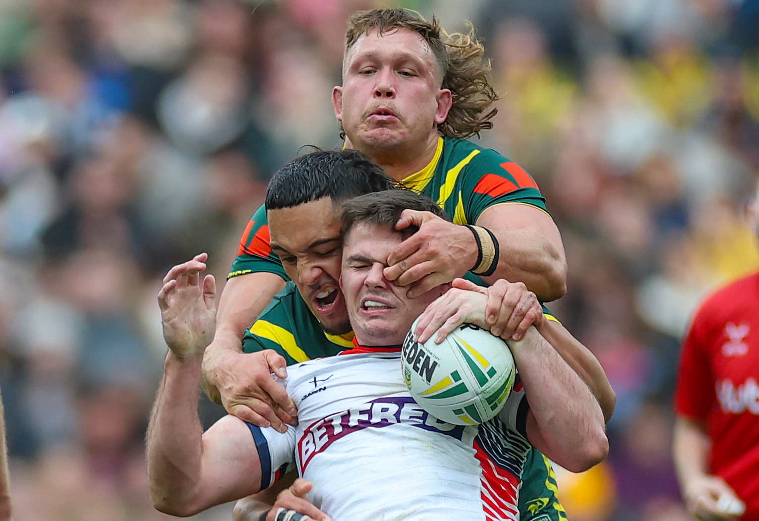 Australia's Reece Walsh being tackled by England rugby players at Wembley.