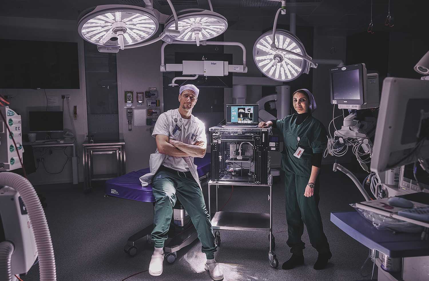 ENT surgeon Tobias Todsen and biomedical engineer Fatemeh Makouei with the 3sonic ultrasound scanner in an operating theatre.