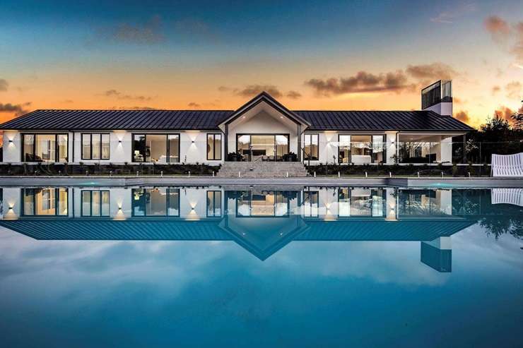 The eight-bedroom, eight-bathroom property at 60a Goldflats Lane, in Auckland's Coatesville, is expected to break post-Covid price records in the suburb. Photo / Supplied