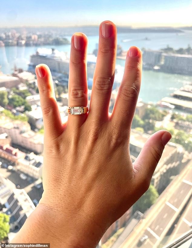 She also shared a photo of her eye-popping diamond engagement ring, featuring a massive sparkler enclosed in a stunning pure gold band