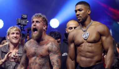 Anthony Joshua weighs in almost two stone heavier than Jake Paul as Briton makes throat-slitting gestures