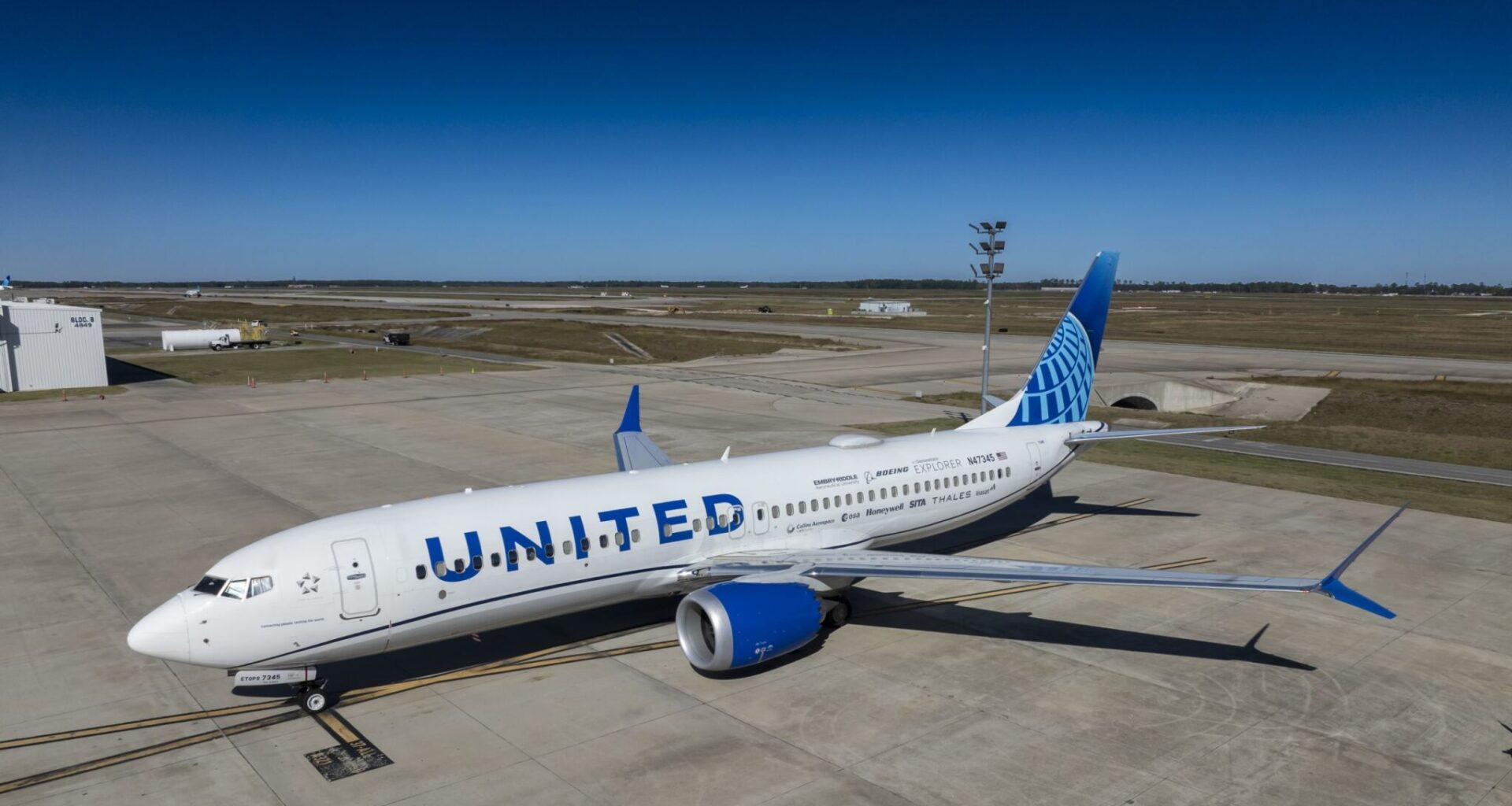 NASA works with Boeing and the ecodemonstrator plane is parked on the tarmac.