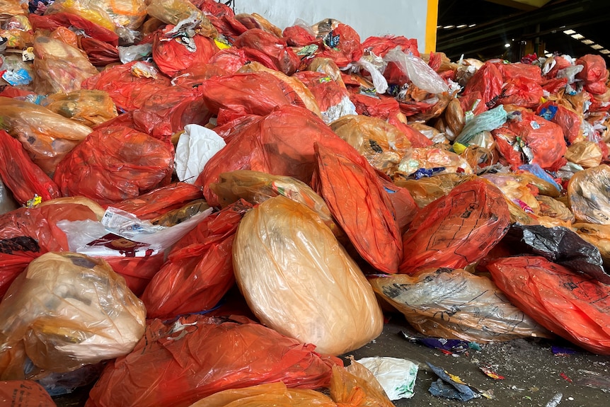 Bags of waste on the factory receiving floor.