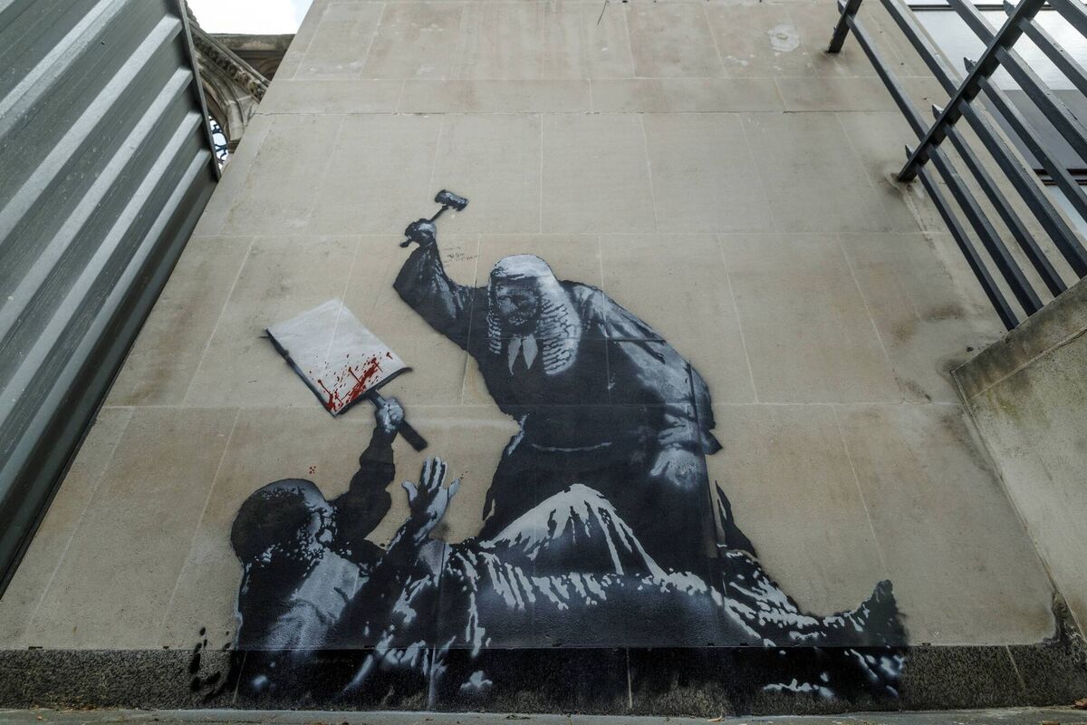 The Banksy mural outside the Royal Courts of Justice in London. Photo: Dan Kitwood/Getty Images
