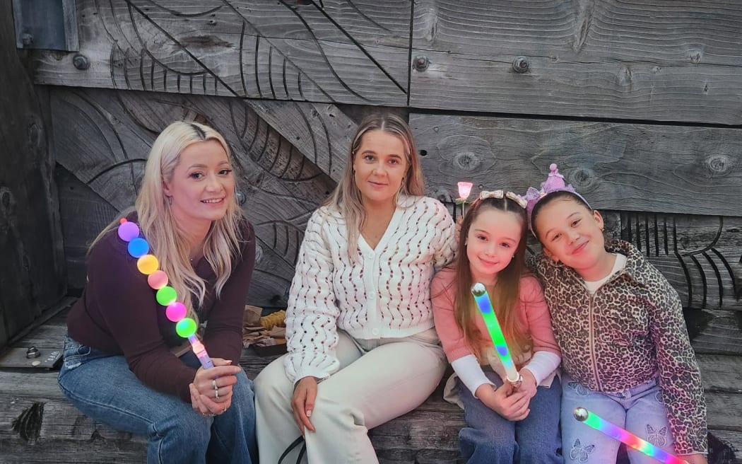 From left: Paige Morgan, Holly Brooks, Mia Spartalis, 8, and Jordyn Siloata, 8, were at the early countdown in Wellington.