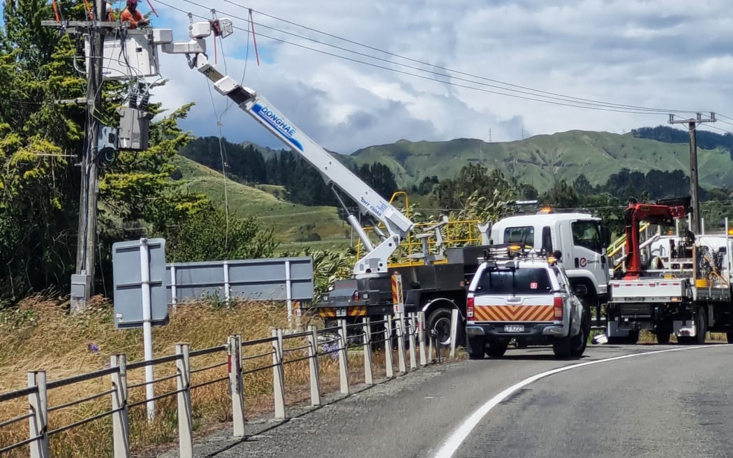Crews from Electra respond to weather-related power outage damages in Tokomaru on Monday.