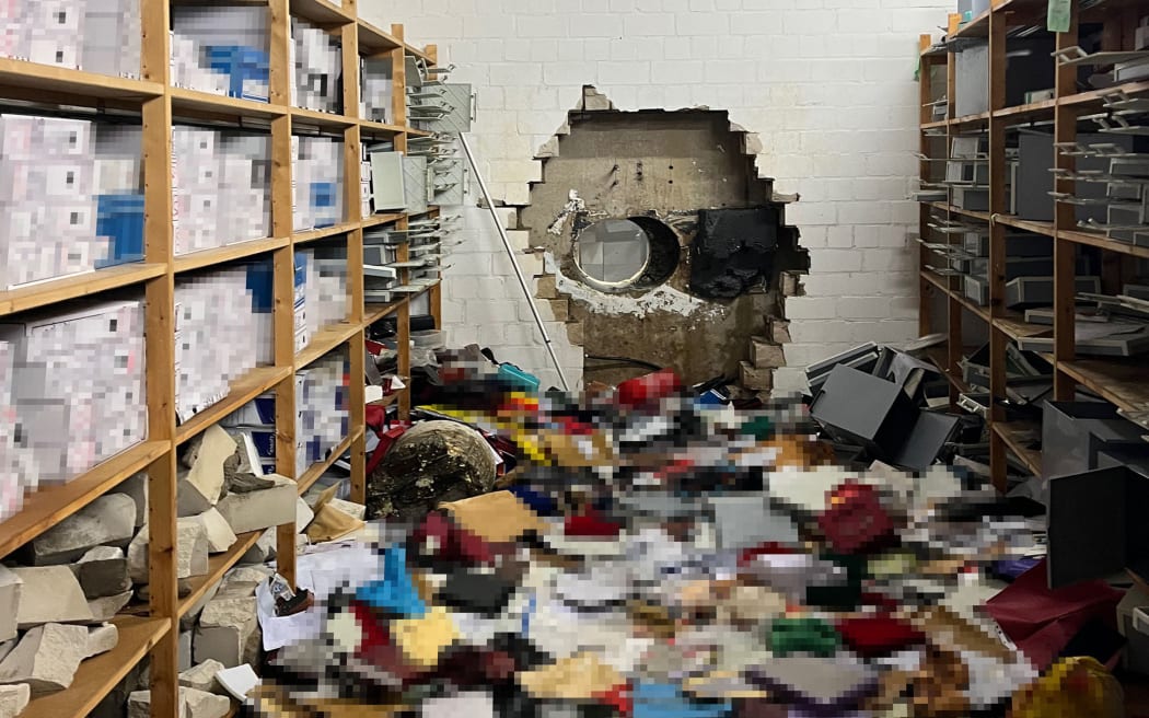 This handout photo taken on December 29, 2025 in Gelsenkirchen, western Germany, and handed out by the Police Gelsenkirchen shows a giant hole in a wall of the bank vault of a Sparkasse bank branch after the unknown perpetrator(s) broke in during the Christmas holidays.