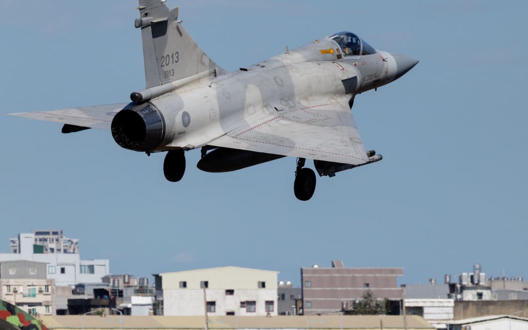 A Taiwanese air force Mirage 2000 fighter jet takes off at Hsinchu Air Base in Hsinchu on December 29, 2025. China launched "major" military exercises around Taiwan on December 29, in what it called a "stern warning" involving live-fire drills in waters and airspace near the island. Taiwan said Monday it had detected four Chinese coastguard ships near the island's waters. (Photo by CHENG Yu-chen / AFP)