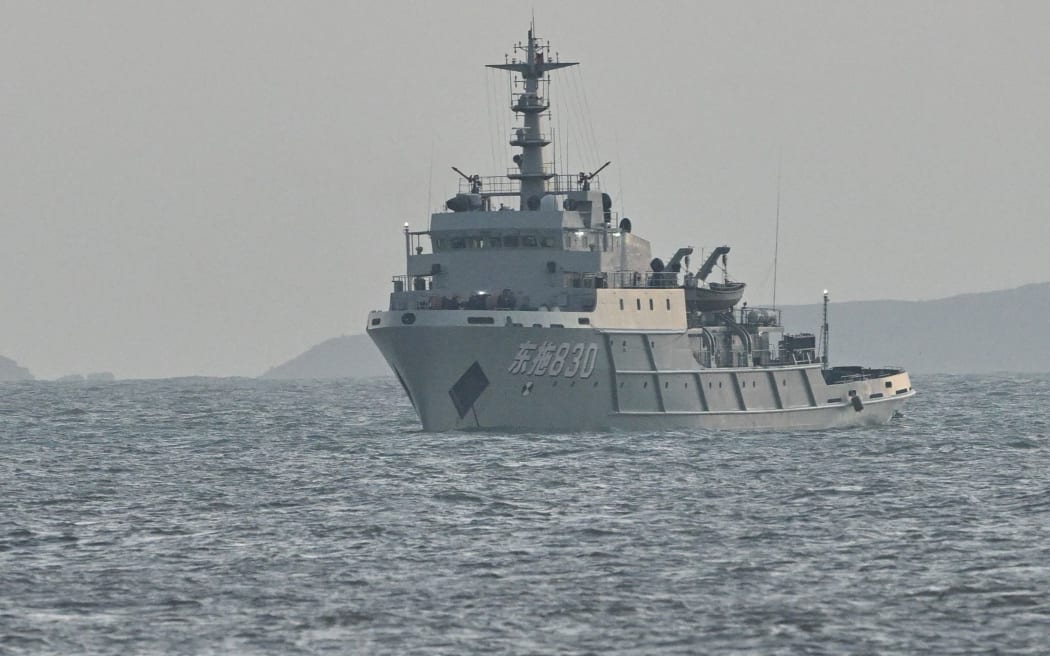 A Chinese ship is seen in waters near Pingtan island, the closest point to Taiwan, in eastern China’s Fujian province on December 29, 2025. China launched live-fire drills around Taiwan on December 29 that it said would simulate a blockade of the self-ruled island's key ports, prompting Taipei to condemn Beijing's "military intimidation". (Photo by ADEK BERRY / AFP)