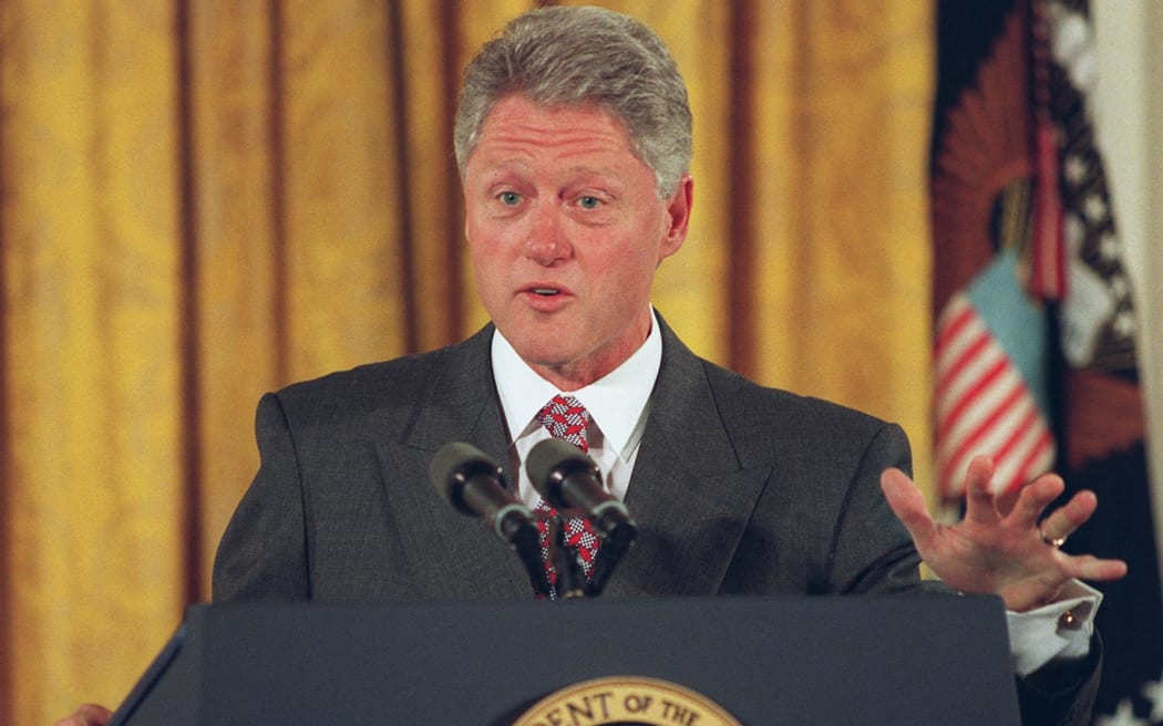 US President Bill Clinton speaks to the press during a bill signing ceremony in the East Room of the White House 07 October in Washington, DC.   Clinton signed the Higher Education Amendments of 1998 into law designed to help disadvantaged children attend universities.   AFP PHOTO       Paul RICHARDS (Photo by Paul J. RICHARDS / AFP)