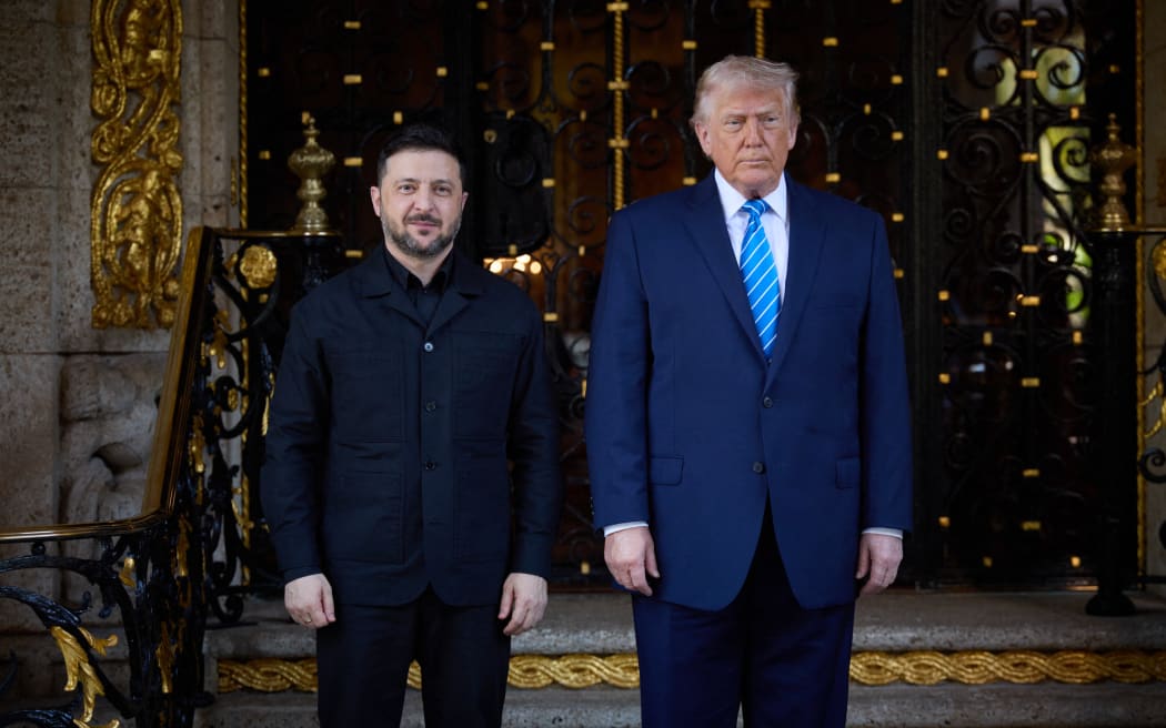 This handout photograph taken and released by the Ukrainian Presidential Press Service on December 28, 2025 shows US President Donald Trump (R) and Ukraine's President Volodymyr Zelensky (L) posing during their meeting for critical talks on ending the war with Russia at Trump's Mar-a-Lago estate in Palm Beach, Florida. (Photo by Handout / UKRAINIAN PRESIDENTIAL OFFICE / AFP) / RESTRICTED TO EDITORIAL USE - MANDATORY CREDIT "AFP PHOTO / UKRAINIAN PRESIDENTIAL OFFICE" - NO MARKETING NO ADVERTISING CAMPAIGNS - DISTRIBUTED AS A SERVICE TO CLIENTS