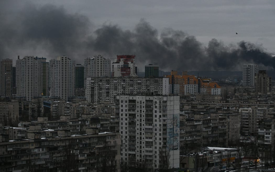 Smoke rising above residential buildings following Russian drones and missiles attack, in Kyiv.