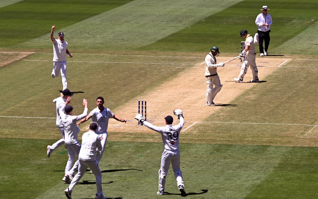 England's Josh Tongue (C) celebrates dismissing Australian batsman Usman Khawaja (3/R).