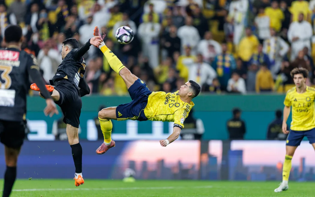 RIYADH, SAUDI ARABIA - NOVEMBER 23: Cristiano Ronaldo of team Al-Nassr FC scores their fourth goal during the Saudi Pro League match between Al Nassr and Al Khaleej at Al Awwal Park on November 23, 2025 in Riyadh, Saudi Arabia. (Photo by Abdullah Ahmed/Getty Images)