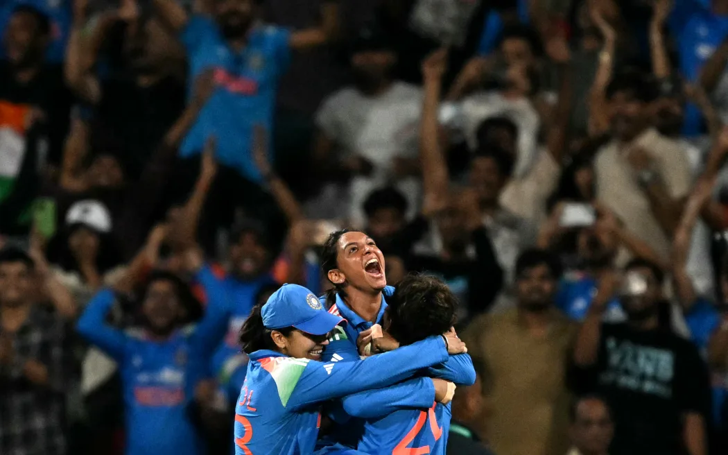 India's captain Harmanpreet Kaur celebrates with teammates after winning the ICC Women's Cricket World Cup 2025 one-day international (ODI) final match between India and South Africa in Mumbai.