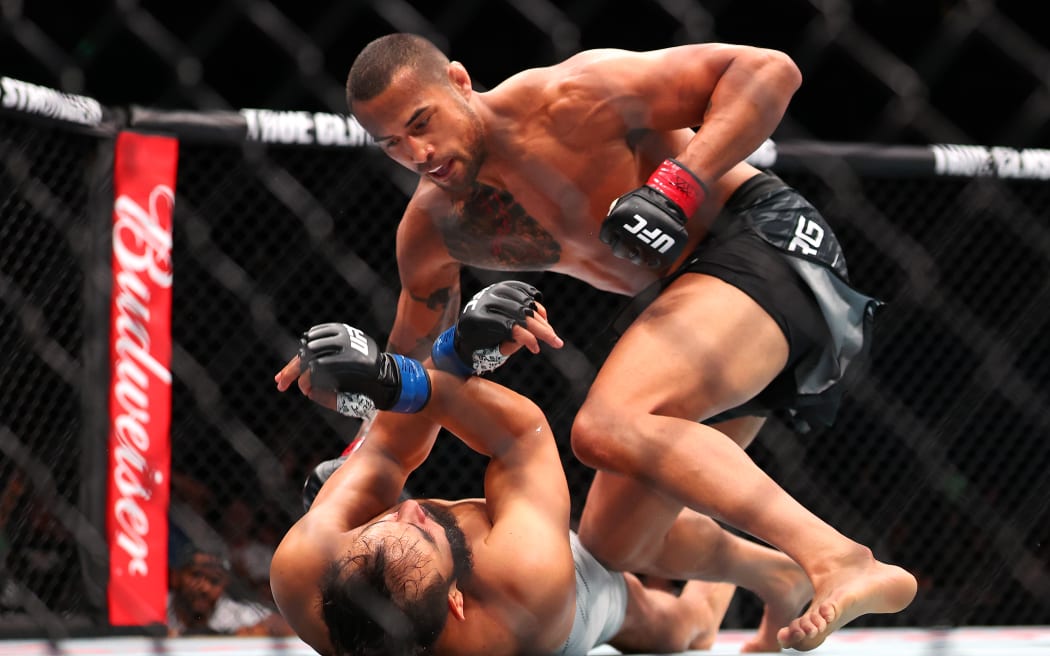 PERTH, AUSTRALIA - SEPTEMBER 28: Carlos Ulberg of New Zealand fights Dominick Reyes of the United States in the Light Heavyweight Bout during the UFC Fight Night at RAC Arena on September 28, 2025 in Perth, Australia. (Photo by Paul Kane/Getty Images)