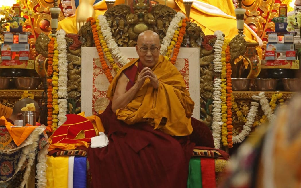 Tibetan spiritual leader the Dalai Lama attends a long-life prayer offering ceremony at the Main Tibetan Temple in McLeod Ganj, near Dharamsala on July 5, 2025. The Dalai Lama said on July 5 he dreamed of living for decades more, as the Buddhist spiritual leader prayed with thousands of exiled Tibetans on the eve of his 90th birthday. (Photo by Sanjay BAID / AFP)