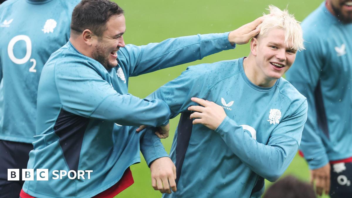 Jamie George ruffles Henry Pollock's hair during a training session