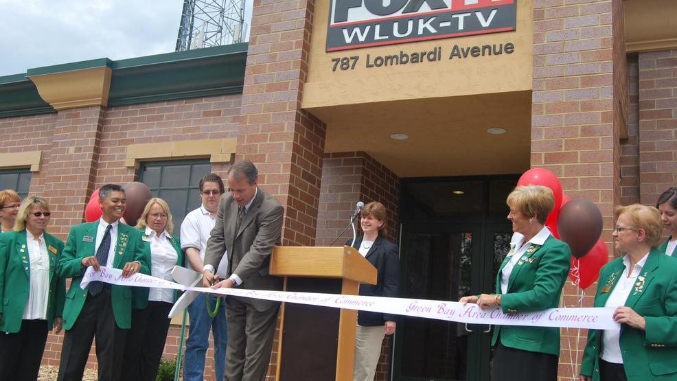 WLUK FOX 11 General Manager Jay Zollar cuts the ribbon on the station's News and Content Center addition June 17, 2009. (WLUK photo)