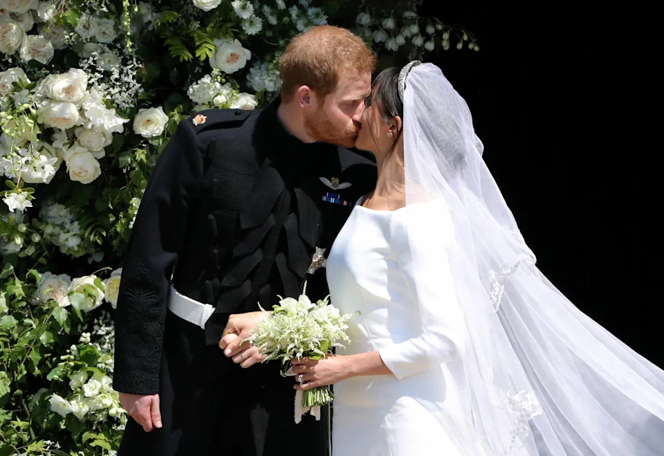 Meghan Markle Kisses Prince Harry on their wedding day