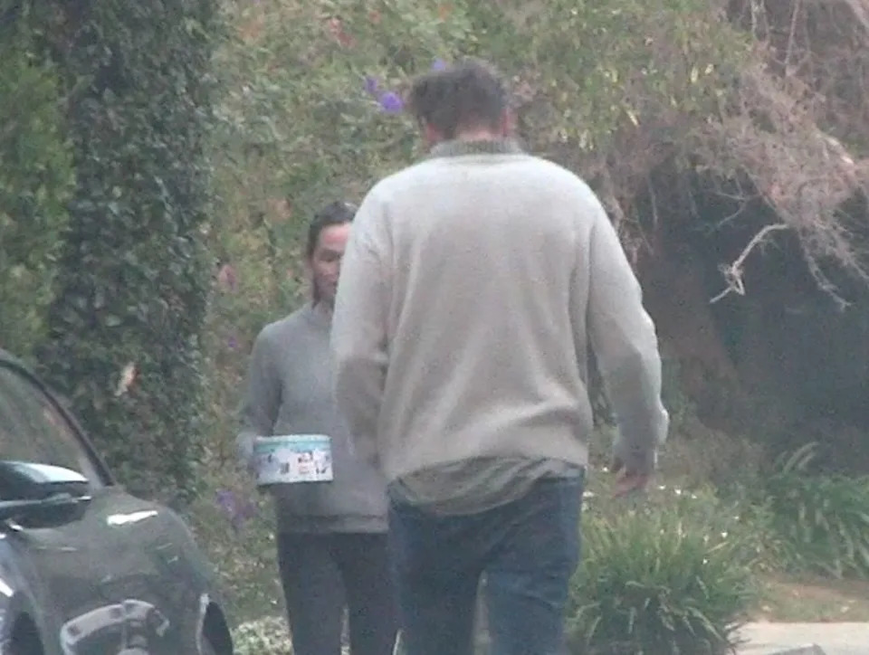 The couple was spotted exchanging holiday gifts by their cars in a rare sighting. /X17online.com