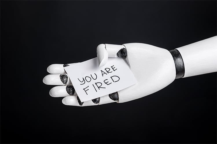 Robotic Hand Holding Sign "you Are Fired"