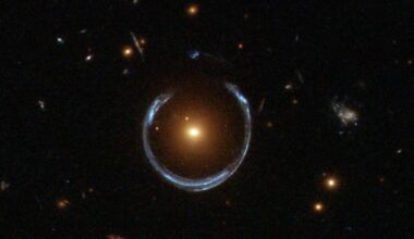 the gravity of a luminous red galaxy (LRG) has gravitationally distorted the light from a much more distant blue galaxy (Credit : ESA/Hubble)