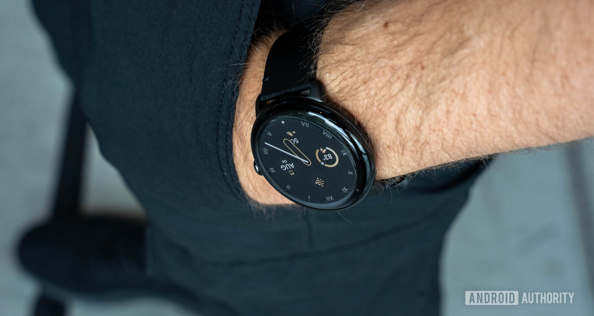 Google Pixel Watch 3 in 45mm size on person's left wrist as it rests in pants pocket