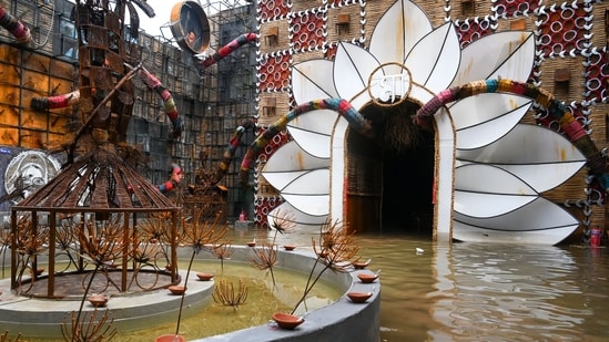 As city of joy - West Bengal's Kolkata - geared up to embrace its biggest festival of the year, Durga Pujo, severe rain hit the region which led to waterlogging across several pandals. Stemming from a strong low-pressure system over the Bay of Bengal, on September 23, heavy overnight showers lashed the city, leading to flooding, waterlogging, transport disruptions and multiple deaths.(Samir Jana/Hindustan Times)