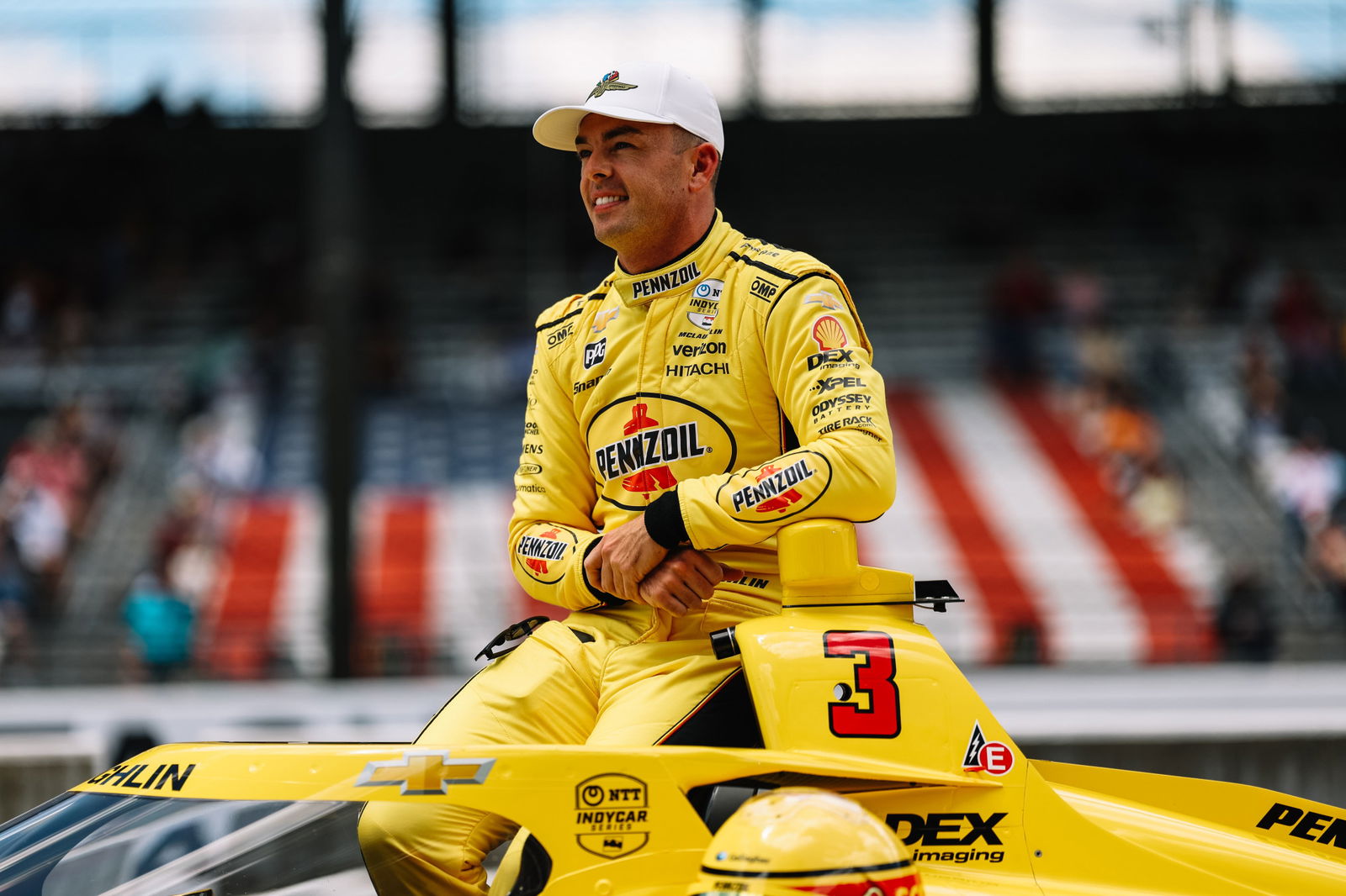 Scott McLaughlin sits atop his Team Penske IndyCar at Indianapolis