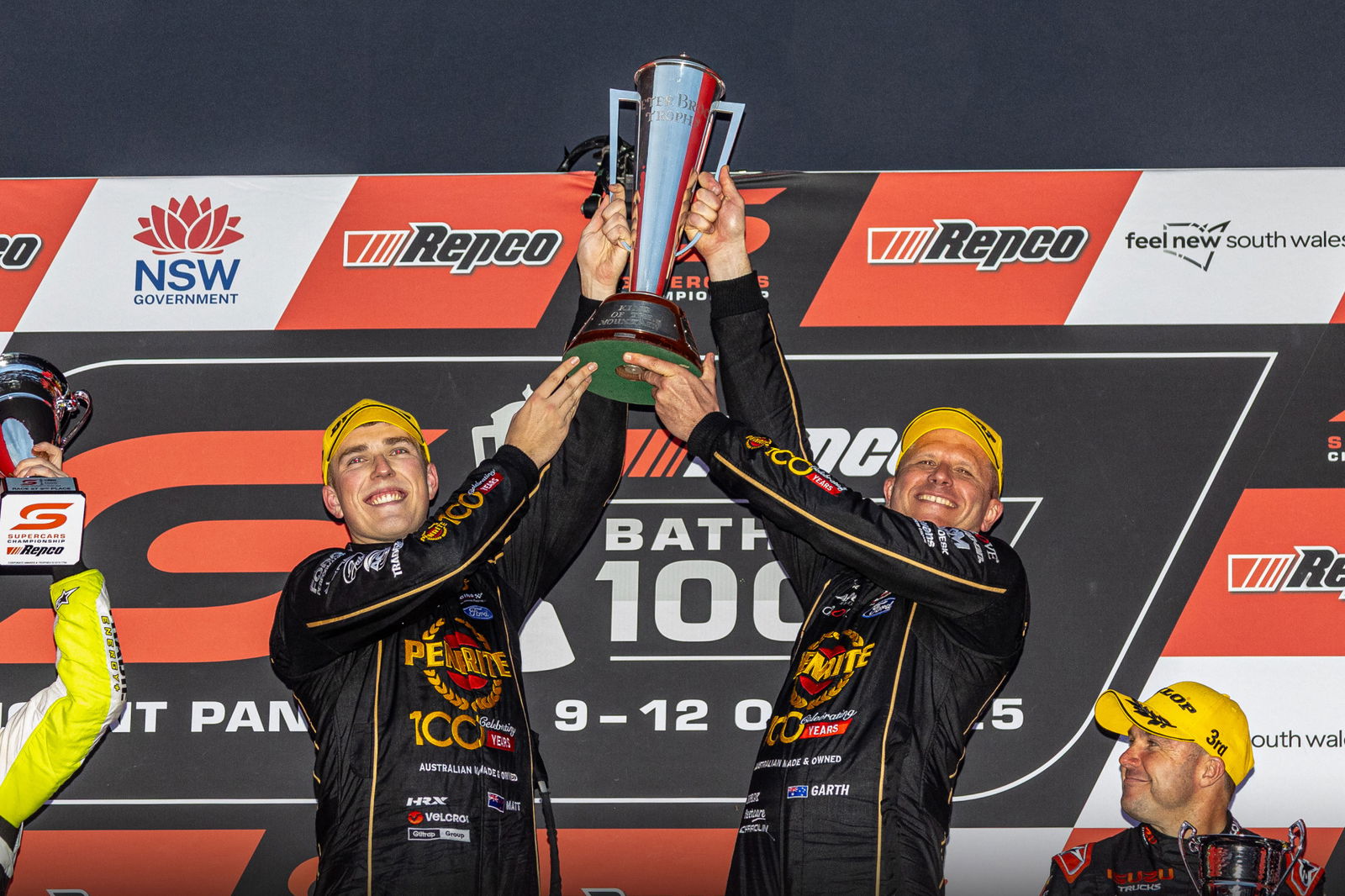 Matt Payne and Garth Tander loft the Peter Brock Trophy after winning the 2025 Bathurst 1000.