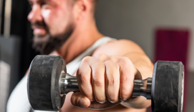 A man doing dumbbell lat raises