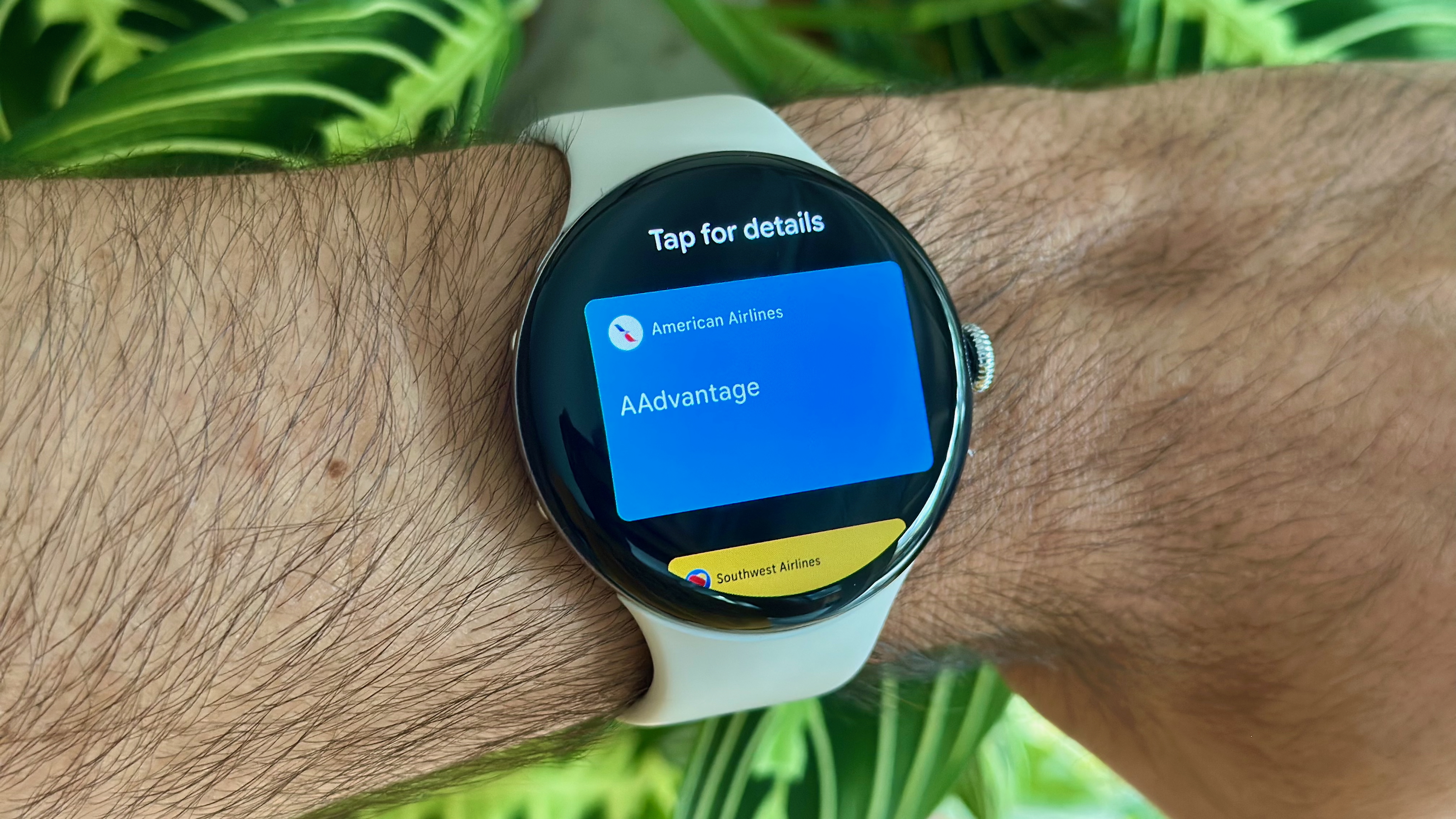 The Google Wallet app showing an AAdvantage loyalty card on the Google Pixel Watch 4.