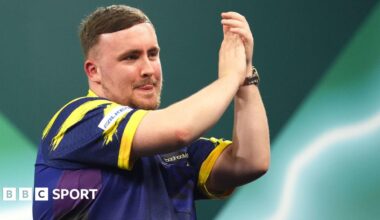 Luke Littler applauds