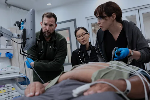 Noah Wyle, Irene Choi and Fiona Dourif in The Pitt.