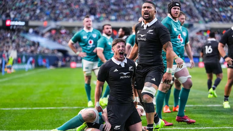 Cam Roigard and Ardie Savea celebrate Roigard's try against Ireland in Chicago.
