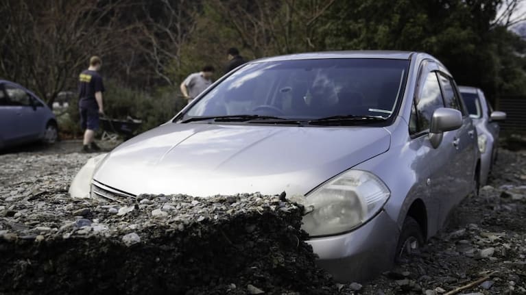 Cars buried by slip debris in Reavers Lane, Queenstown