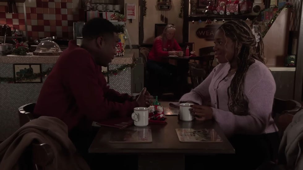 coronation street, james and dee dee bailey sitting in the cafe opposite each other